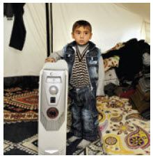 A Syrian refugee in his tent in a Turkish camp. 