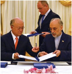 IAEA director general Yukiya Amano and Iranian Vice-President Ali Akhbar Salehi sign a roadmap for the clarification of past and present issues regarding Iran’s nuclear program in Vienna. (Photo: D.Calma/IAEA)