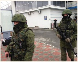 Unidentified gunmen, known at the time as "little green men" were on patrol at Simferopol Airport in Ukraine's Crimea peninsula in February 2014. (Photo: Elizabeth Arrott / VOA)