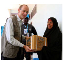 Writer Johannes van der Klaauw distributes kitchen sets and other non-food items to those in need in the besieged city of Taiz.