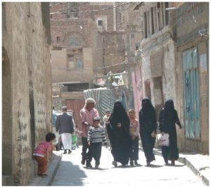 Locals in the old city of Sanaa. Almost all Yemeni women wear a niqab or hijab in public. 