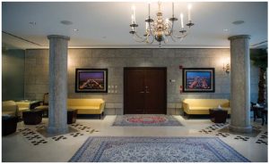 The front foyer of the embassy and residence is grand and imposing, with several pillars and traditional rugs. (Photo: Ashley Fraser)