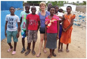 Susan Christie, president Children's Bridge Foundation, in December 2016, with some children at the GOF orphanage in Watamu, Kenya. CBF sponsors their education and Christie visits every year.