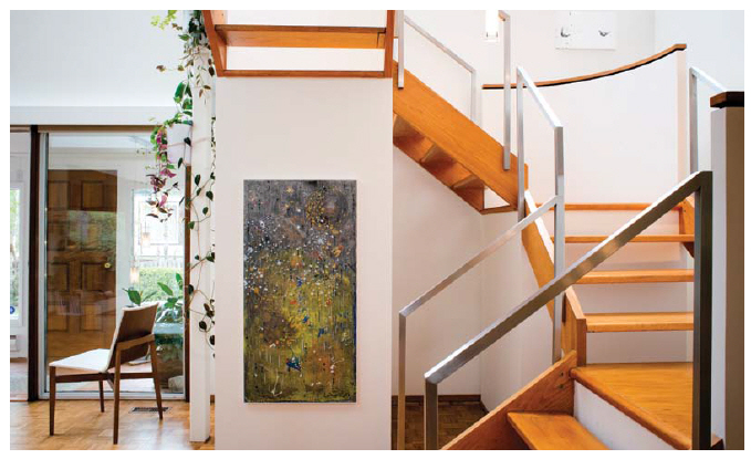 The winding staircase is one of the main floor's more stunning features.  (Photo:  Ashley Fraser)