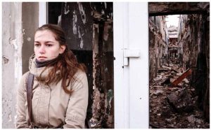 This woman stands in front of a blown-out building in Kurakhove, in Ukraine's Donetsk region. In 2018, the conflict with Russian-backed forces in Eastern Ukraine will drag on, with the Minsk negotiations at an impasse. (Photo: o.V. SVOboda)