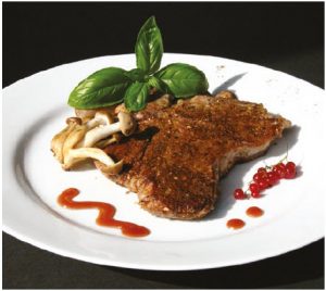 Mushroom-dusted veal chops with Mustard Red Currant Sauce make for a meaty main course. (Photo: Larry Dickenson)