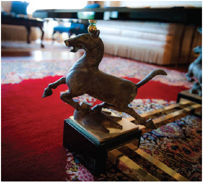 This galloping horse ardorns one of the legs of a coffee table in the main reception room of the residence. (Photo: Ashley Fraser)