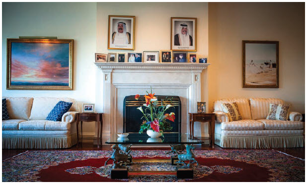 A painting in the large sitting room off the hall, where ochre walls, a fireplace and fringed, cream-coloured sofas blend formality and comfort, shows Kuwait's connection with the water, situated, as it is, at the tip of the Persian Gulf. (Photo: Ashley Fraser)