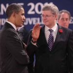 U.S. President Barack Obama and Prime Minister Stephen Harper converse at the G20 Summit in Cannes, France, in November.