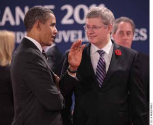 U.S. President Barack Obama and Prime Minister Stephen Harper converse at the G20 Summit in Cannes, France, in November.