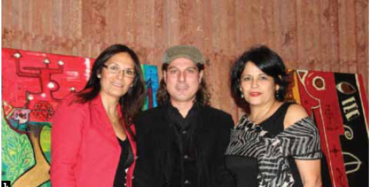 Cuban Ambassador Teresita Sotolongo, right, hosted a reception in honour of Cuba’s culture day. She’s shown with Cuban painter Yoel Finalé, centre, and curator Lilia Faulkner.