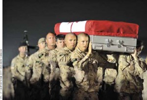 Soldiers take part in a ramp ceremony at Kandahar Airfield for Master Corporal Francis Roy, who died in Kandahar City in June 2011.