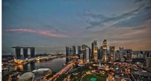 Singapore, whose skyline appears here at dusk, sits near one of the most important shipping lanes in the world.