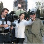 From left: Neil Barrett, director of photography, with film director Rachel Goslins, and photographer Norman H. Gershman on set in Tirana, Albania.