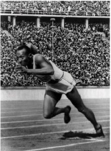 American track athlete Jesse Owens at the start of record-breaking 200-metre race during the Olympic games 1936 in Berlin.