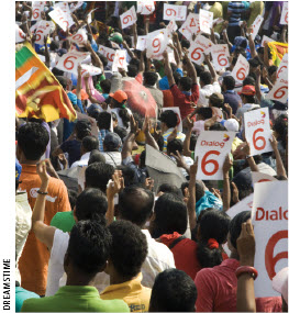 Fans in Colombo, Sri Lanka cheer their team at the Cricket World Cup 2011 final against India. India won.  