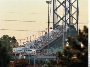 The Ambassador Bridge between Detroit and Windsor is heavily trafficked. The new Detroit River International Crossing project would add a second bridge to the region.