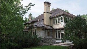 The exterior of the home is a classic design, made to blend with its Rockcliffe surroundings by architect Barry Hobin. 