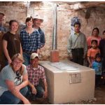 Volunteers for the Guatemala Hot Stove project after they completed a project. Clockwise from top left: Canadian volunteers Keith Walker, Rowan Delgrande, Melissa Cordick, Keith Cordick, Quiche-Maya mason Juan Hernandez Cochojil and Lisa Walker. At right, the family of Micaela Cox-Hernandez and Andres Ramos Garcia, who received the stove.