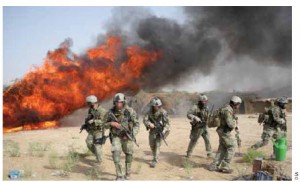 DEA officers and American soldiers take part in a hashish-burning operation in Afghanistan. 