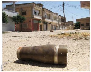 A shell in the middle of the street in Homs, Syria, is a remnant of the heavy attack levelled on the city last year. 