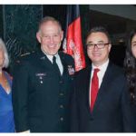 At right, Afghan Ambassador Barna Karimi and his wife, Storai, hosted a national day reception. Former chief of defence staff Walter Natynczyk and his wife, Leslie (at left) attended. (Photo: Bruce MacRae)
