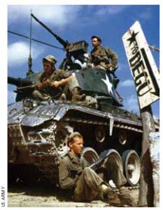 The crew of an M-24 tank along the Naktong River front in Korea.