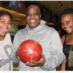 The Canadian Federation of University Women’s diplomatic hospitality group hosted its first bowling event at McArthur Lanes. Zambian High Commissioner Bobby Mbunji Samakai, centre, took part with his daughters, Victoria (left) and Precious (right). (Photo: Ulle Baum)