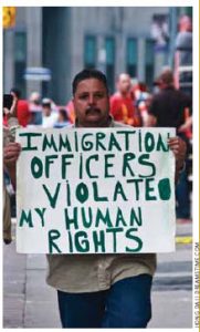 A man at Queen’s Park in Toronto during the G8/G20 Summit in 2010 protests his treatment by immigration officers.