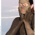 A woman gives herself a mask from mud in Israel’s Dead Sea. Nearly eight of 10 Israelis report their health is good to very good.
