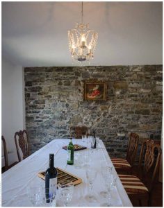 The dining room, where stone walls put the building in its historical context. 