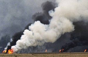 An oil-well set ablaze by the occupation forces of Iraq at the Al Maqwa oil fields in Kuwait during the Iraq invasion of 1991, a precursor to the U.S.-led invasion of Iraq in 2003. 