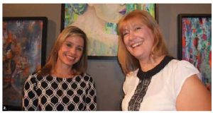 Honduran Ambassador Sofia Lastenia Cerrato Rodriguez, left, and Argentine artist Silvia Bompadre pose in front of Ms Bompadre’s paintings. Artwork from 11 Latin American countries was presented at the St. Brigid's Centre for the Arts. (Photo: Ulle Baum)