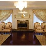This formal drawing room features gold and cream-coloured sofas and chairs with a tapestry motif, all from the UAE.