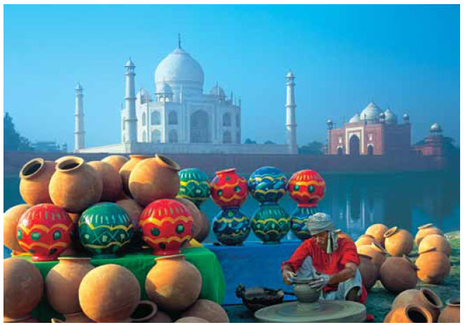 The renowned Taj Mahal in Agra, 200 kilometres southwest of Delhi, sits majestically behind an array of Indian handicrafts.