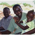Sudan 2008: Alnoor, our interpreter, and his daughter in Kortala, his home village. With the renewed fighting in that area, I worry about what has happened to them all.