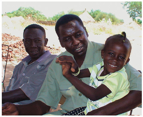 Sudan 2008: Alnoor, our interpreter, and his daughter in Kortala, his home village. With the renewed fighting in that area, I worry about what has happened to them all.