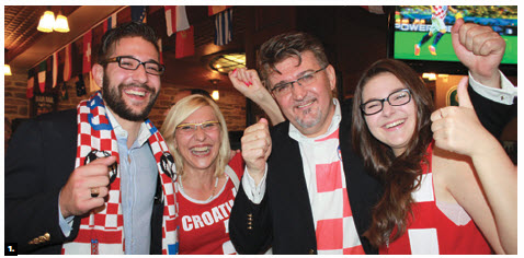To mark Croatia’s National Day and the World Cup Inaugural Match between Croatia and Brazil, Ambassador Veselko Grubisic and his family celebrated at the Earl of Sussex Pub. From left, Matthew, Martha, Veselko and Ana Maria Grubisic. (Photo: Ulle Baum)