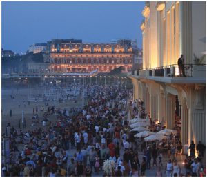 A Bastille Day celebration at the “grande plage” in Biarritz on the Atlantic Coast. On the right, is the casino and in the background, the Hotel du Palais, which Napoleon III originally built for his wife, Empress Eugénie. 