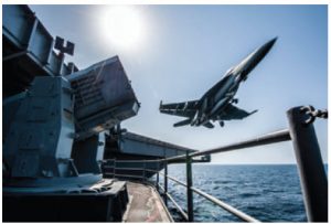 An American F/A-18 launches from the flight deck of an aircraft carrier. It is involved in U.S. security operations in Iraq and Syria. 