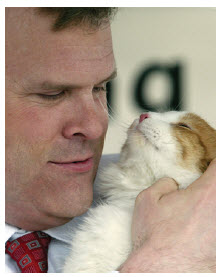 With his beloved late cat, Thatcher.