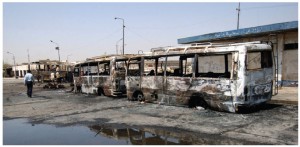 A bus parked near a terminal in central Baghdad, Iraq, was destroyed by two car bombs in a 2005 attack orchestrated by Sunnis stepping up their insurgency in protest of the Shi'ite government.