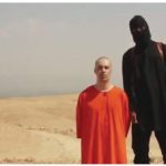 IS released photos such as this one to show journalist James Foley with his IS assassin, thought to be Mohammed Emwazi, a British man born in Kuwait. Prior to his identification, the British media referred to him as “Jihadi John.”