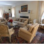 The home features plenty of space for entertaining, including this main drawing room, which features an antique Kerman rug, a reminder of Mrs. Delcorde’s Iranian heritage.