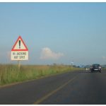 Certain places in South Africa, such as this one on the N4 near Witbank, feature signs warning of vehicle hijackings. (Photo: Zakysant )