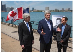 From left, Michigan Governor Rick Snyder, Prime Minister Stephen Harper and Murray Howe, Gordie Howe’s son, announced in May that the Detroit River International Crossing will be named the Gordie Howe International Bridge. (Photo: PMO)