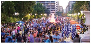 Greeks in Athens celebrate the results of the July 5 referendum on austerity measures proposed by the EU and IMF. (Photo: © Conejota | Dreamstime.com)