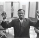 Patrice Lumumba, the Congo’s first democratically elected leader, raises his hands, injured by shackles, after being released from prison. He was later assassinated. (Photo: Nationaal Archief Fotocollectie Anefo)