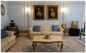 The first reception room is decorated in pale blue and features large portraits of the king and queen of Thailand. (Photo: Dyanne Wilson)