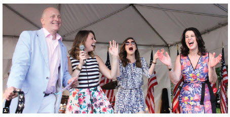 U.S. Ambassador Heyman, left, and his wife, Vicki, right, hosted a 4th of July party at Lornado, the name of the ambassador's residence. With their daughters Caroline, left, and Liza, they joined the band on stage. (Photo: Ulle Baum) 